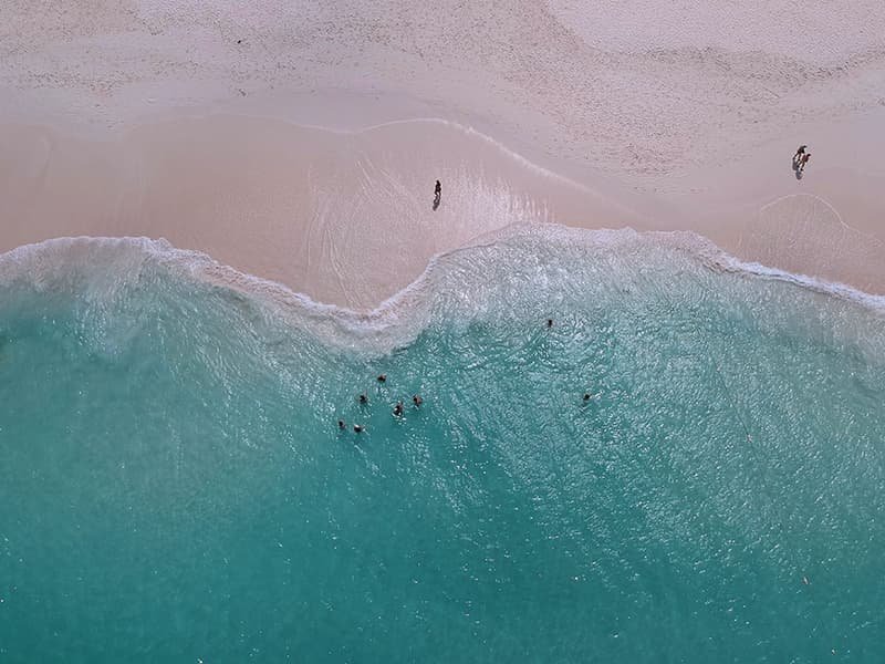 People playing in the ocean in Aruba