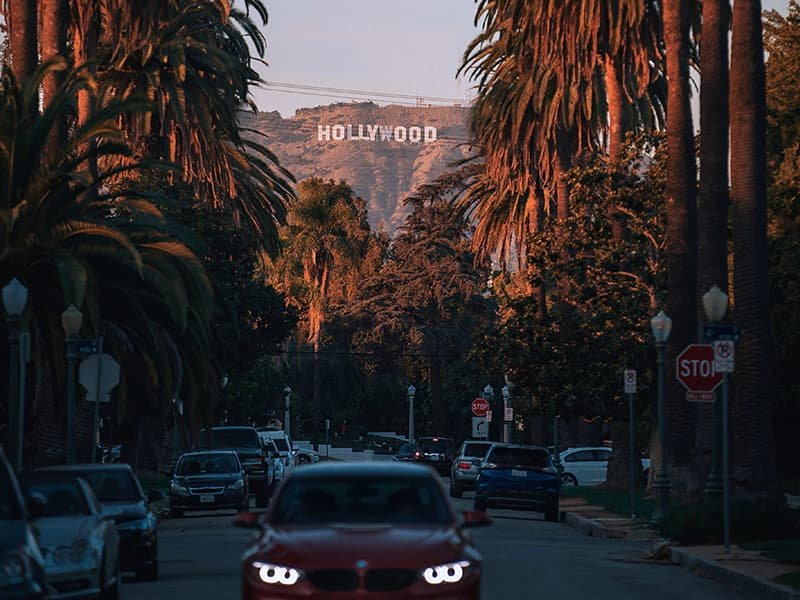 a view down a California street at the Hollywood sign