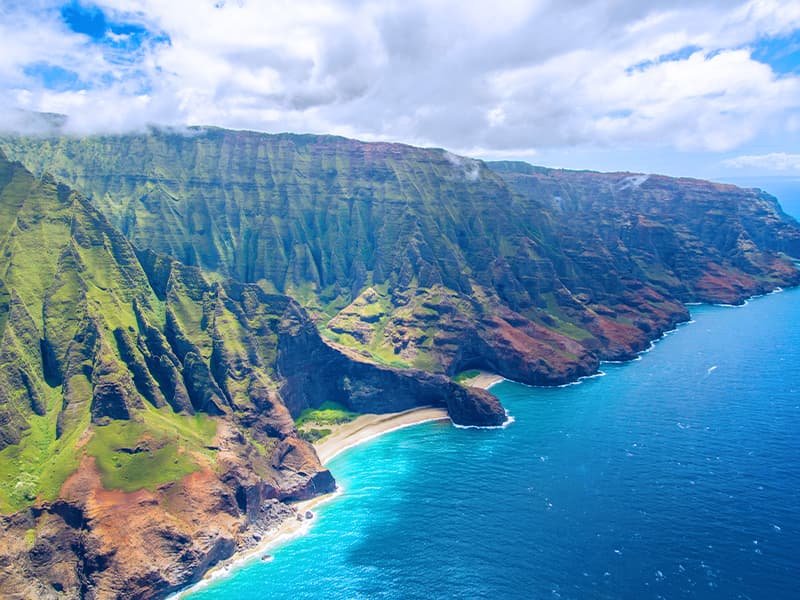 an aerial coastal view of the ocean in Kauai, Hawaii