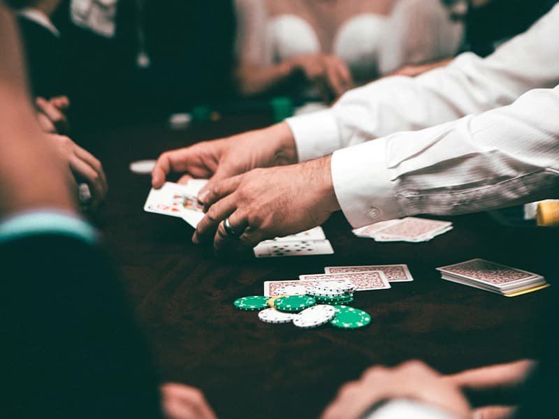 A dealer in Vegas shuffling cards