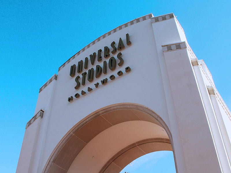 A large entrance sign that says Universal Studios Hollywood